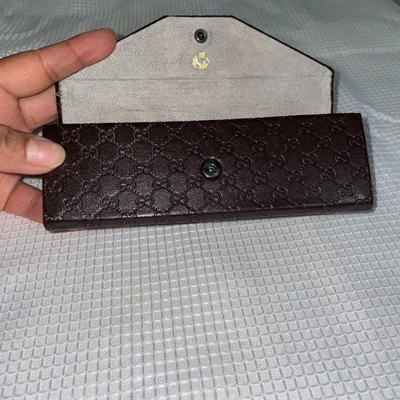 brown leather monogrammed foldable eyeglasses case from Gucci. - Picture 2 of 16